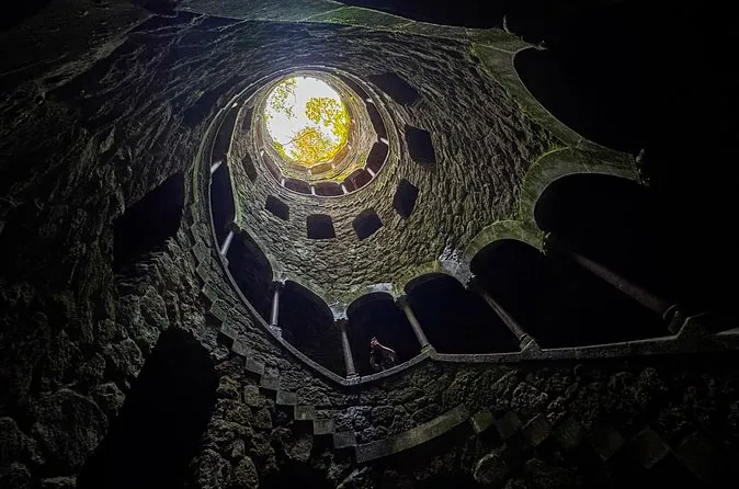 Looking up the dark Initiation Well to a bright circle of sky